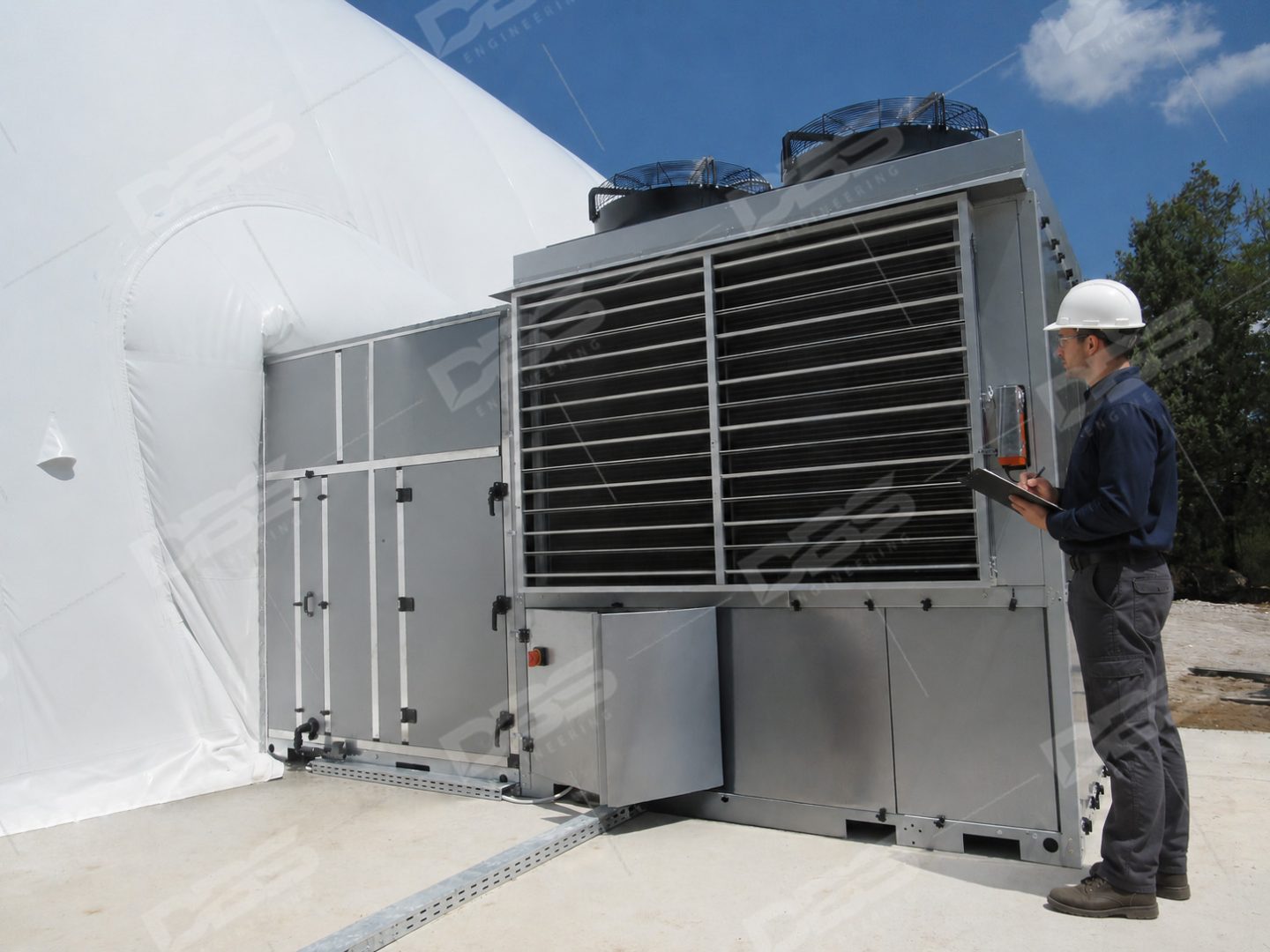 Picture of a engineer inspecting an heat pump unit